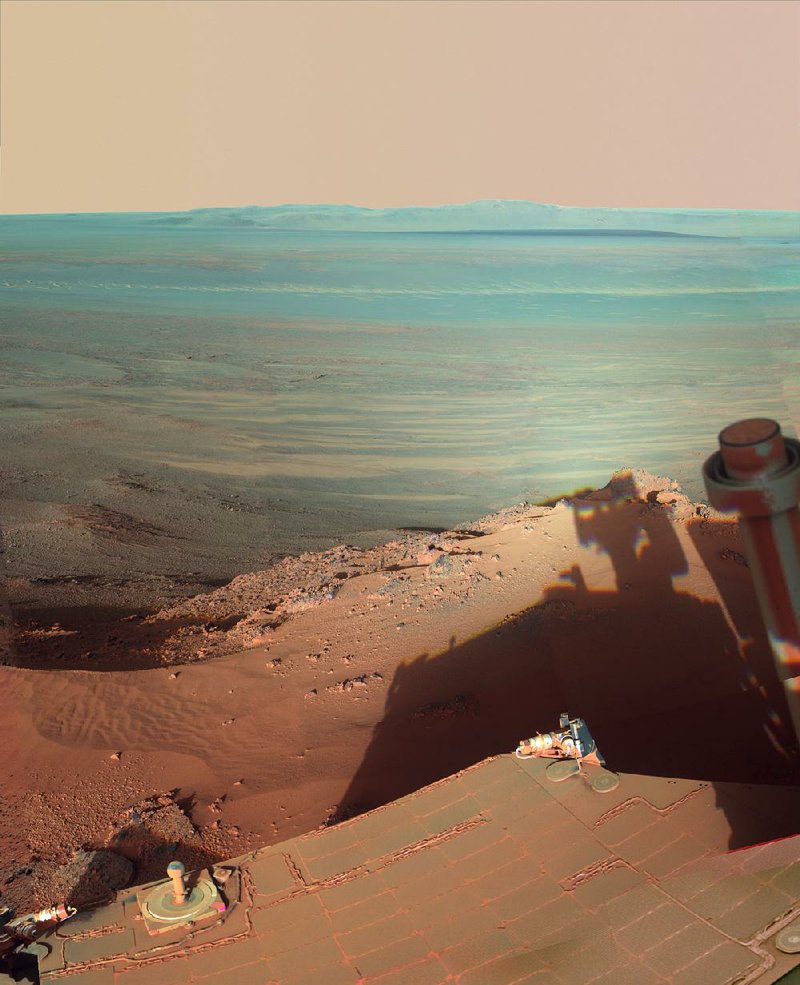 The Mars Opportunity rover casts its shadow over the Endeavour Crater on Mars in this image it transmitted May 22, 2012. Opportunity landed on Mars in January 2004 on what was to have been a 90-day mission. 