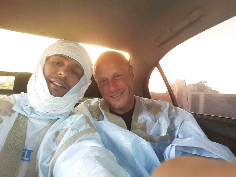 Former Guantanamo prisoner Mohamedou Ould Slahi (left) and his former guard, Steve Wood, pose for a selfie during their reunion in Mauritania in May.  