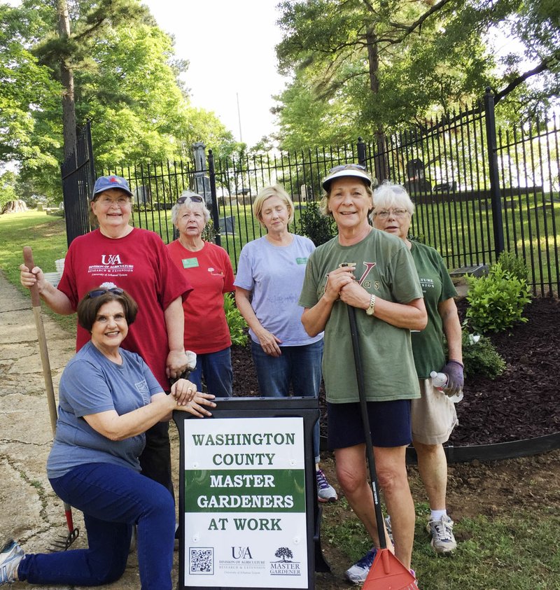 Courtesy photo Washington County Master Gardeners put their design, plant selection and planting skills to work at the request of the Evergreen Cemetery Board. The desire was to update and beautify the Center Street entrance to the Fayetteville cemetery in time for Memorial Day. Volunteers who worked on the project included Marilyn Hefner (from left), Evergreen Cemetery Board president; Regina Gable; Marsha West; Debbie Mohler; Ginny Wiseman and Chris Bell, Washington County Master Gardener project chairs; and not pictured were Doris Cassidy, Mary Beth Lohr, Judy Haden and Jayne Laster.