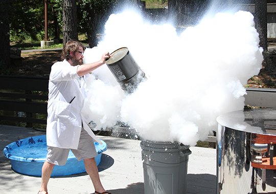 Jeremy Mackey, Director of Education, holds a demonstration on pressure with liquid nitrogen during the 6th annual Tinkerfest at the Mid-America Science Museum on Saturday, June 16, 2018. (The Sentinel-Record/Rebekah Hedges)