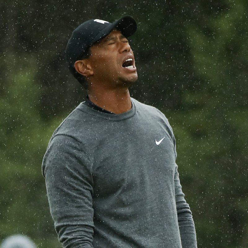 Tiger Woods reacts after playing his shot from the 16th tee during the second round of the U.S. Open Golf Championship, Friday, June 15, 2018, in Southampton, N.Y. (AP Photo/Carolyn Kaster) 