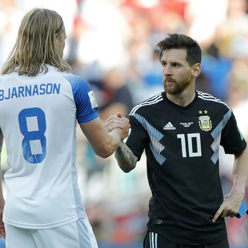 Argentina's Lionel Messi, right, shake hands with Iceland's Birkir Bjarnason at the end of the group D match between Argentina and Iceland at the 2018 soccer World Cup in the Spartak Stadium in Moscow, Russia, Saturday, June 16, 2018. (AP Photo/Ricardo Mazalan)