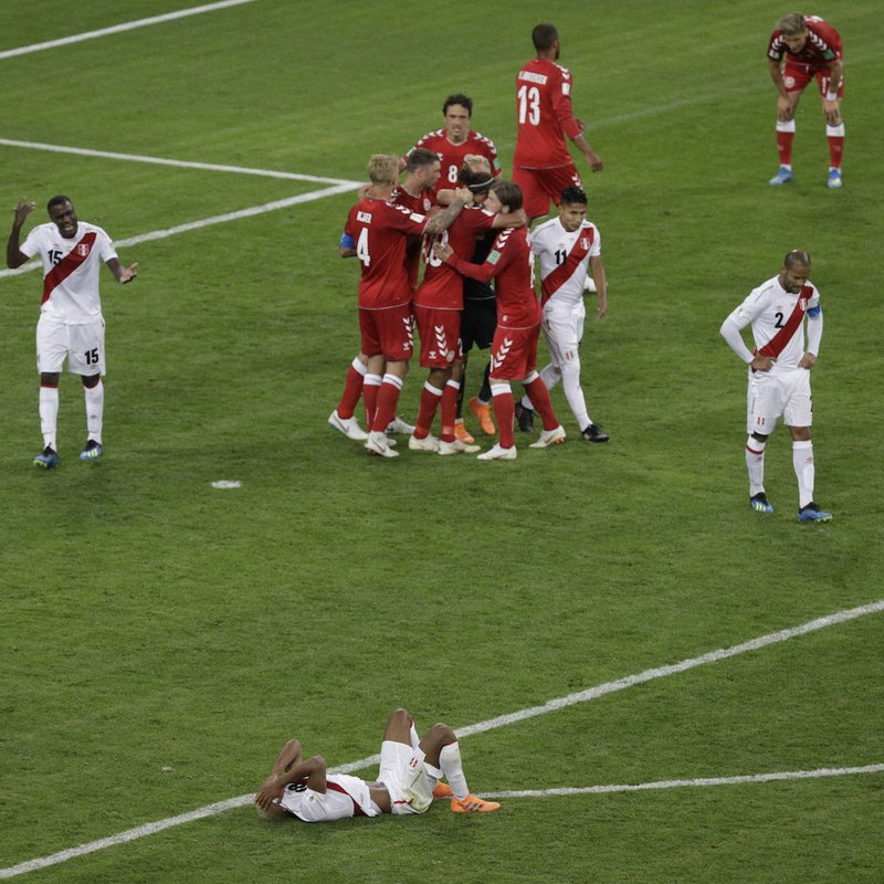 Denmark players celebrate after winning the group C match between Peru and Denmark at the 2018 soccer World Cup in the Mordovia Arena in Saransk, Russia, Saturday, June 16, 2018. (AP Photo/Gregorio Borgia)