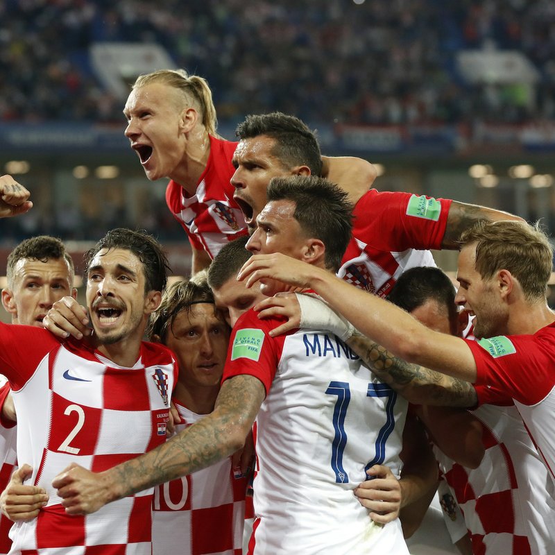 Croatia's players celebrate after teammate Luka Modric, scoring from a penalty spot during the group D match between Croatia and Nigeria at the 2018 soccer World Cup in the Kaliningrad Stadium in Kaliningrad, Russia, Saturday, June 16, 2018. (AP Photo/Petr David Josek)