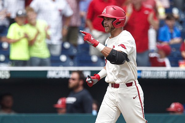 Arkansas designated hitter Luke Bonfield rounds the bases after hitting a home run during the fifth inning of a College World Series game against Texas on Sunday, June 17, 2018, in Omaha, Neb.