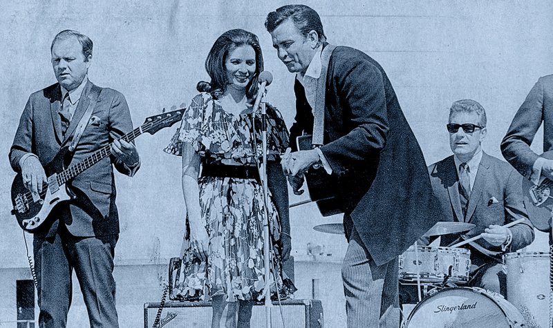 Johnny Cash and June Carter Cash perform for 900 prisoners and 200 guests at Cummins Prison Farm on April 10, 1969. A Democrat-Gazette photo illustration from a Arkansas Democrat-Gazette file photo.
