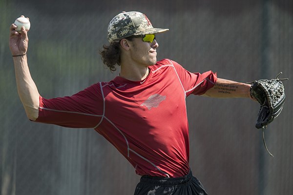 Blaine Knight, Arkansas pitcher, throws Saturday, June 16, 2018, during Arkansas practice at the Creighton University practice field in Omaha, Neb. Arkansas will play Texas Sunday at 1:00 p.m. in the first round of the NCAA Men's College World Series.