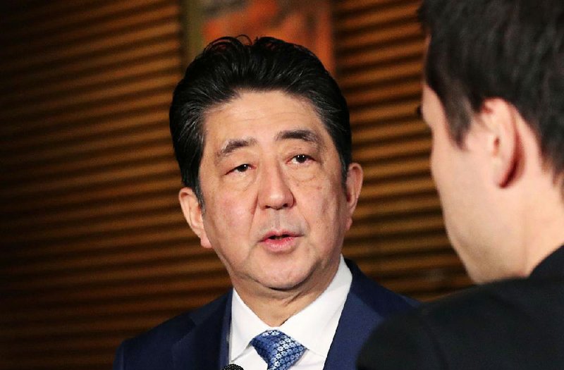 Japanese Prime Minister Shinzo Abe speaks to reporters following a North Korean missile launch, at his official residence in Tokyo Wednesday, Nov. 29, 2017.  