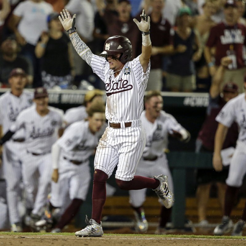 Mississippi State second baseman Hunter Stovall (13) celebrates as he runs to home plate for the winning run against Washington on a single by Luke Alexander in the ninth inning of an NCAA College World Series baseball game in Omaha, Neb., Saturday, June 16, 2018. Mississippi State won 1-0. (AP Photo/Nati Harnik)