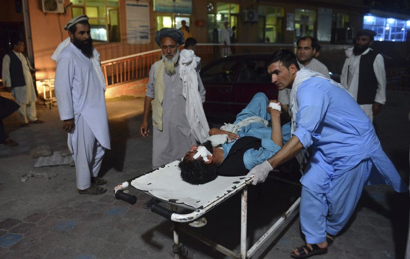 A wounded man is brought by stretcher into a hospital in Jalalabad city, capital of Nangarhar province, east of Kabul, Afghanistan, Saturday, June 16, 2018.  (AP Photo/Mohammad Anwar Danishyar)