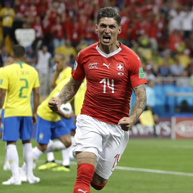 Switzerland's Steven Zuber celebrates after scoring his side's opening goal during the group E match between Brazil and Switzerland at the 2018 soccer World Cup in the Rostov Arena in Rostov-on-Don, Russia, Sunday, June 17, 2018. (AP Photo/Themba Hadebe)