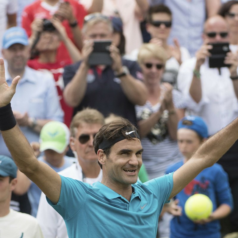 Roger Federer celebrates after he beats Milos Raonic in the final tennis match of the ATP Mercedes Cup in Stuttgart, Sunday June 17, 2018. (Marijan Murat//dpa via AP)