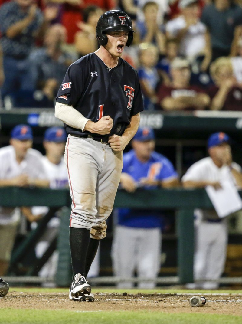 Texas Tech's Cody Farhat (1) reacts after scoring against Florida on a two-run single by Gabe Holt in the fifth inning of an NCAA College World Series baseball game in Omaha, Neb., Sunday, June 17, 2018. Braxton Fulford also scored on the play. (AP Photo/Nati Harnik)