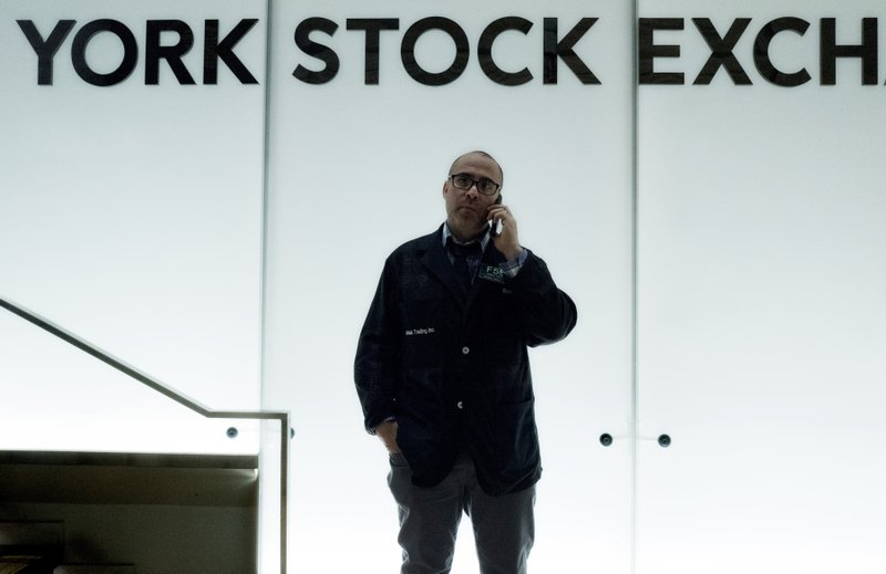 In this Jan. 2 file photo, a trader talks on his phone before the start of trading at the New York Stock Exchange. The U.S. stock market opened at 9:30 a.m. EDT on Monday. (AP Photo/Mark Lennihan, File)