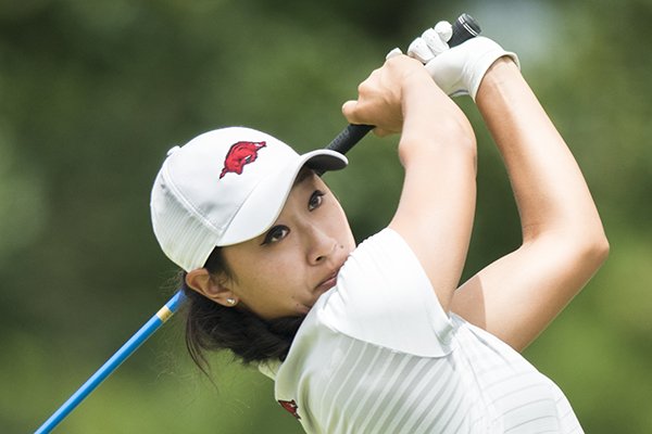 Razorbacks golfer Dylan Kim swings during a qualifier to get into the LPGA tournament this week, Monday, June 18, 2018 at the Pinnacle Country Club in Rogers.