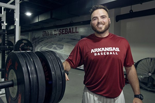 Blaine Kinsley, Arkansas's new assistant strength and conditioning coach for baseball, poses Thursday, Sept. 21, 2017, at the Arkansas baseball practice facility in Fayetteville.