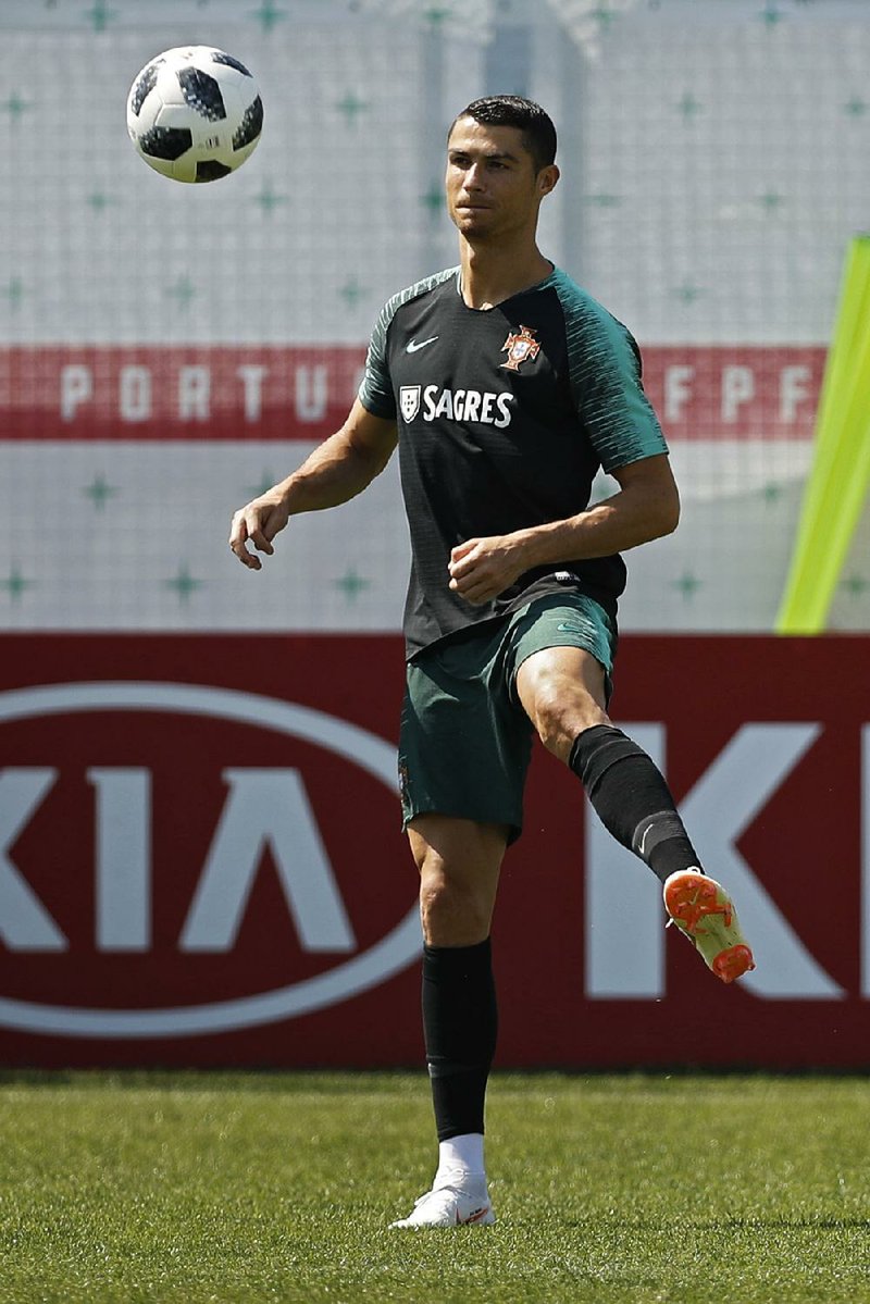 Portugal's Cristiano Ronaldo plays the ball during the training session of Portugal at the 2018 soccer World Cup in Kratovo, outskirts Moscow, Russia, Monday, June 18, 2018. 