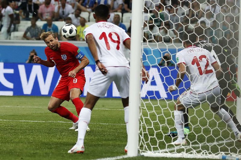 England’s Harry Kane scores the winning goal on a header in a 2-1 victory against Tunisia during a Group G match of the World Cup on Monday at Volgograd Arena in Volgograd, Russia. It was Kane’s second goal of the match. 