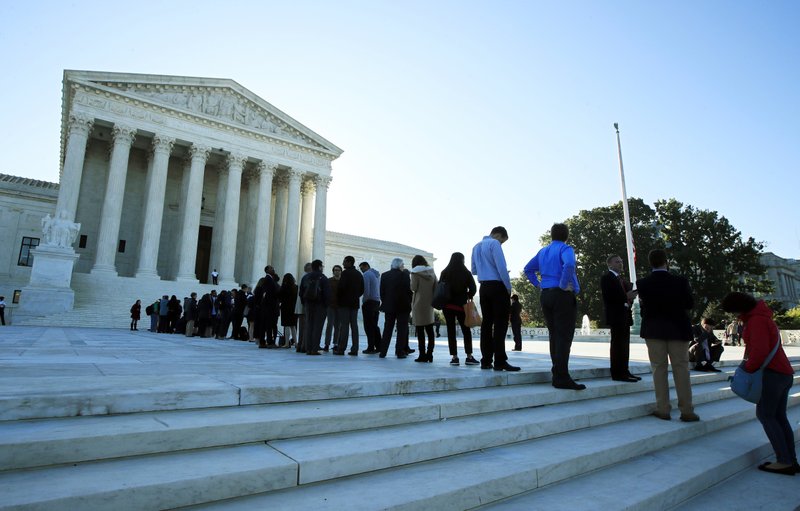 The Associated Press LEGISLATIVE DISTRICTS: In this Oct. 3, 2017, file photo, people line up outside the U.S. Supreme Court in Washington to hear arguments in a case about political maps in Wisconsin that could affect elections across the country. The justices ruled against Wisconsin Democrats who challenged legislative districts that gave Republicans a huge edge in the state legislature.