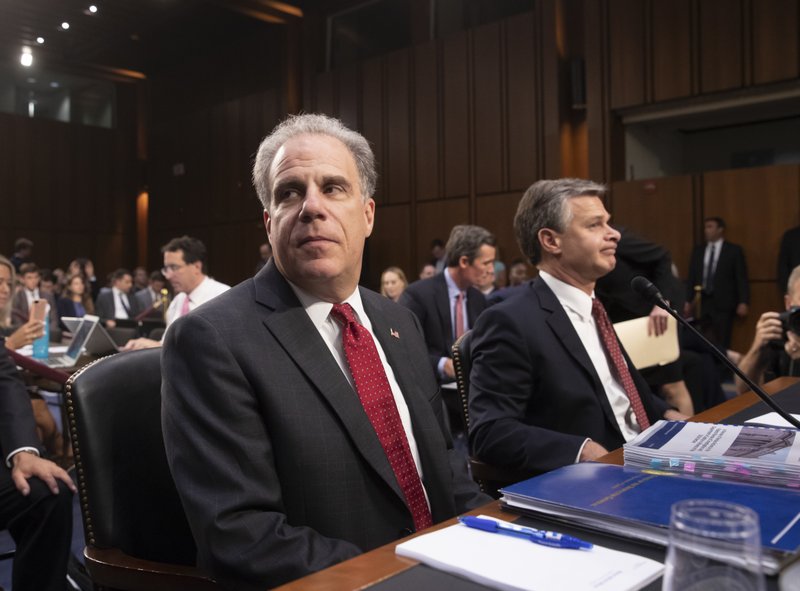 The Associated Press SENATE JUDICIARY COMMITTEE: Justice Department Inspector General Michael Horowitz, left, and FBI Director Christopher Wray, arrive to testify as the Senate Judiciary Committee examines the internal report of the FBI's Clinton email probe and the role of former FBI Director James Comey's actions during the 2016 presidential campaign, on Capitol Hill in Washington, Monday.