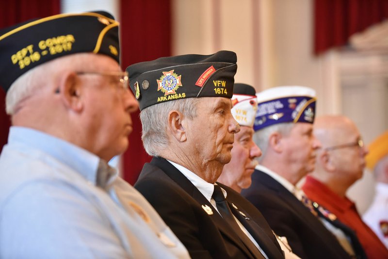 Darrell Darner (second from left), a retired sergeant major, listens Monday during a news conference at the Veterans Health Care System of the Ozarks where it was announced almost 20,000 cases are being reviewed for a possible misdiagnosis by a hospital pathologist in Fayetteville. Darner was found to be one of the cases misdiagnosed three years ago and is having to have reconstructive surgery on his nose. 