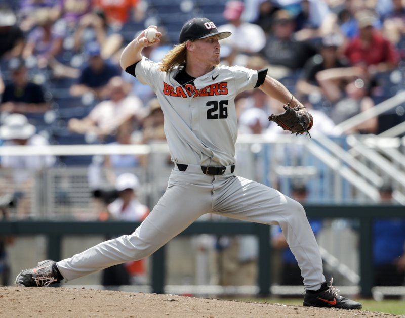 Oregon State pitcher Bryce Fehmel (26) works against Washington in the fourth inning of an NCAA College World Series baseball elimination game in Omaha, Neb., Monday, June 18, 2018. (AP Photo/Nati Harnik)