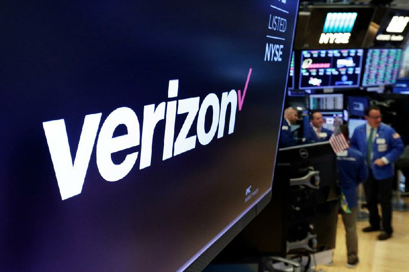 A trading post on the floor of the New York Stock Exchange displays the Verizon logo in April. The company says it will no longer sell phone owners’ tracking information to data brokers.