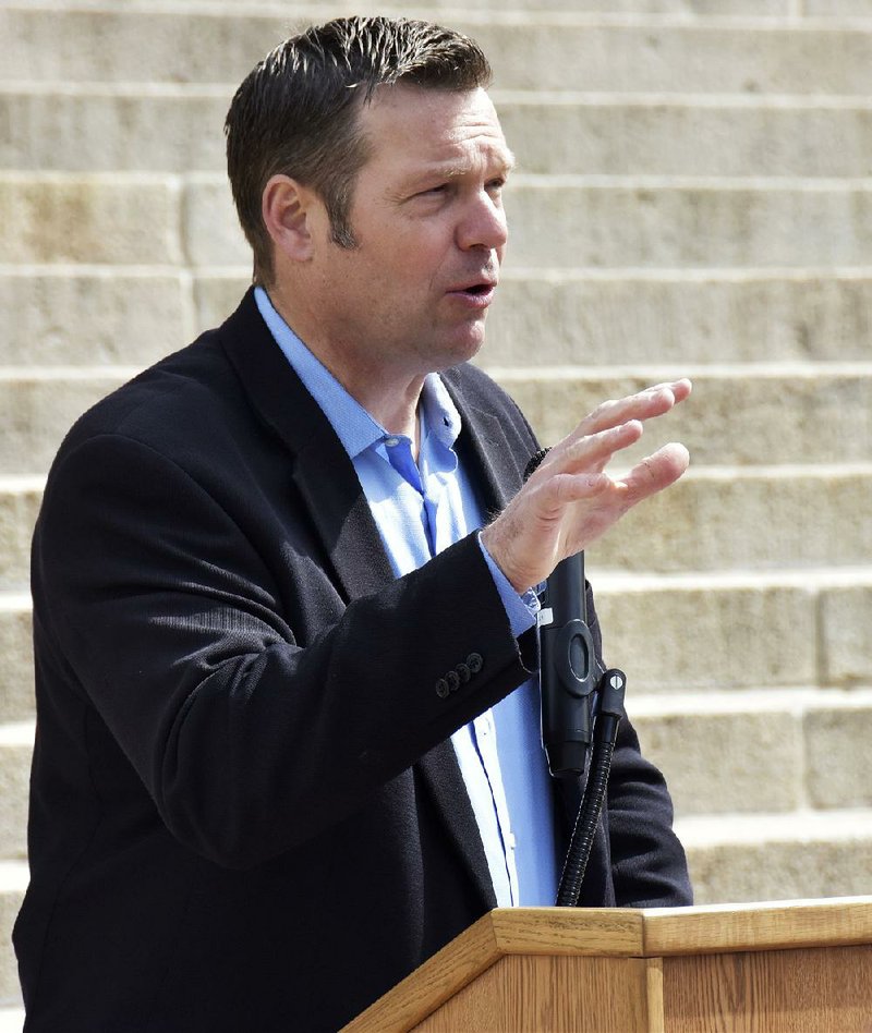 In an email Tuesday, Kansas Secretary of State Kris Kobach called the suit “yet another attack on secure and fair elections in America.”