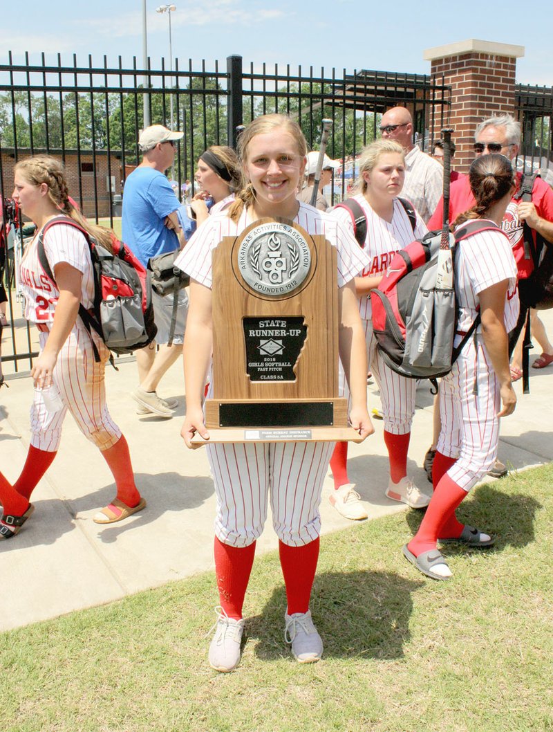 MARK HUMPHREY ENTERPRISE-LEADER Farmington 2018 graduate Camryn Journagan poses with the State Runner-Up trophy won by the Lady Cardinal softball team at the conclusion of the 5A State softball tournament. The Lady Cardinals went 3-1 at Harrison, beating Magnolia, 5-4; Paragould, 7-0; and De Queen, 8-3; before losing 3-2 to Greenbrier in the championship May 19 at Benton. Journagan has been named Female Athlete-of-the-Year for school year 2017-2018 at Farmington by the Enterprise-Leader.