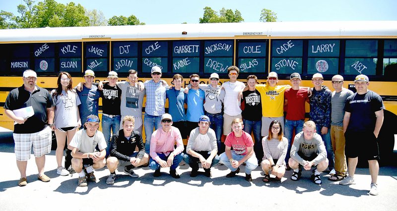 Shelley Williams Special to the Enterprise-Leader The 2018 Prairie Grove baseball team coached by Chris Mileham (left) poses outside the high school before leaving for the State 4A baseball tournament in May. Four Tigers were selected to the 4A-1 All-Conference baseball team.