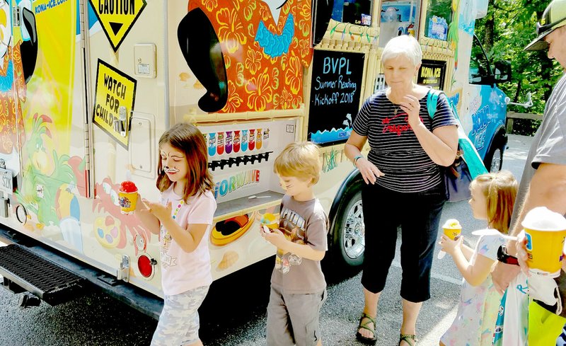 Photo submitted Snow cones at the Bella Vista Public Library was the perfect way to cool off at the Summer Reading Kick-Off.