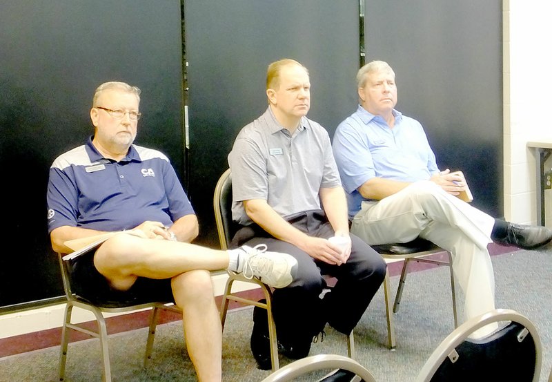 Lynn Atkins/The Weekly Vista' Keith Ihms, director of golf maintenance, Tom Judson, general manager, and Phillip Wright, director of golf operations, listen to a question from a POA member during a session of Coffee and Questions at Riordan Hall last week.