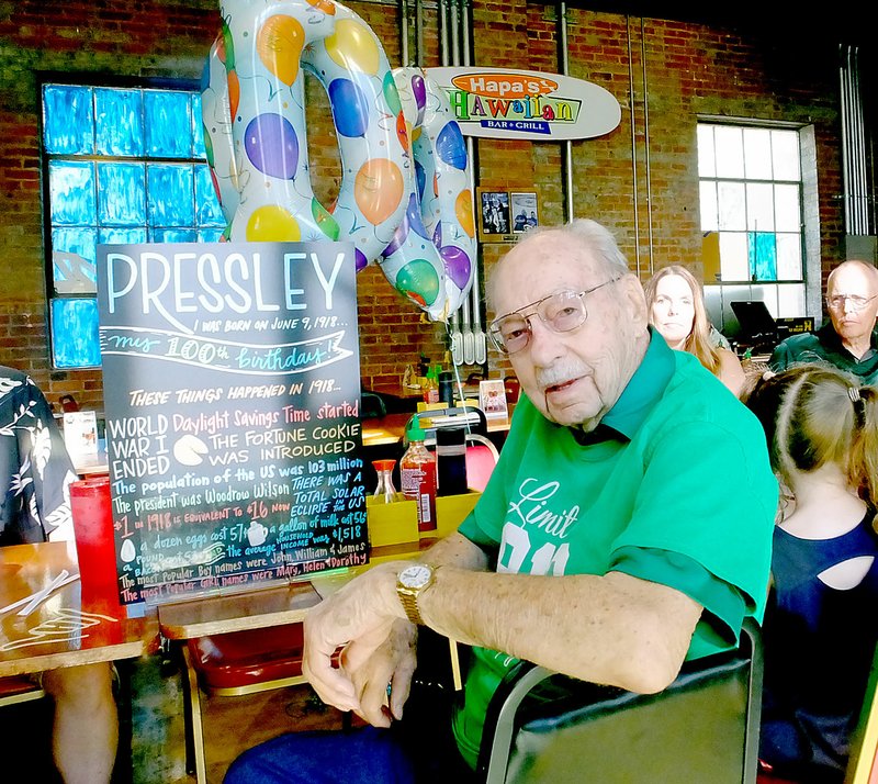 Lynn Atkins/The Weekly Vista Pressley Williams celebrated his 100th birthday with a Luau at Hapa's Hawaiian Grill in Rogers on June 9th. Williams, who lives alone, said the secret to a long and happy life is hard work and a jigger of Chivas Scotch each day.