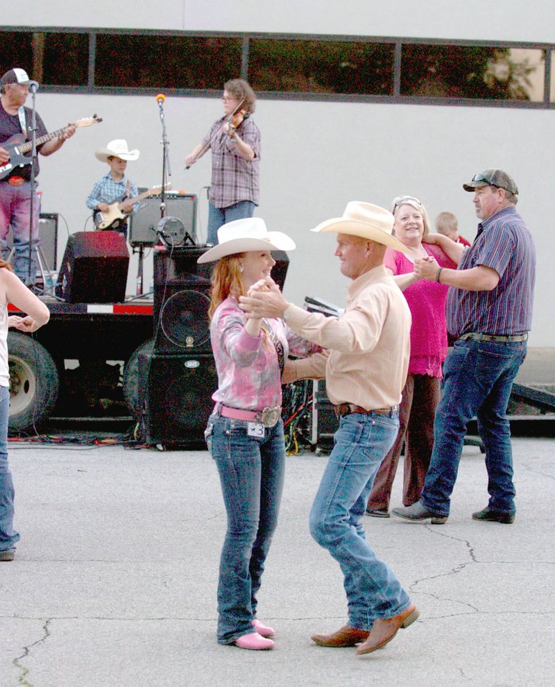 MARK HUMPHREY ENTERPRISE-LEADER Couples dance during the 2017 Lincoln Riding Club Rodeo street dance on the Lincoln Square, which is always held on Wednesday, prior to the rodeo.