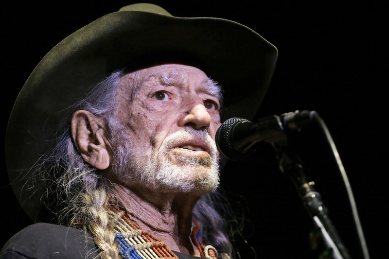 FILE - In this Jan. 7, 2017, file photo, Willie Nelson performs in Nashville, Tenn. Nelson has called out current immigration policies as "outrageous" and extended an offer to meet President Donald Trump at one of the detention centers at the U.S.-Mexico border. (AP Photo/Mark Humphrey, File)