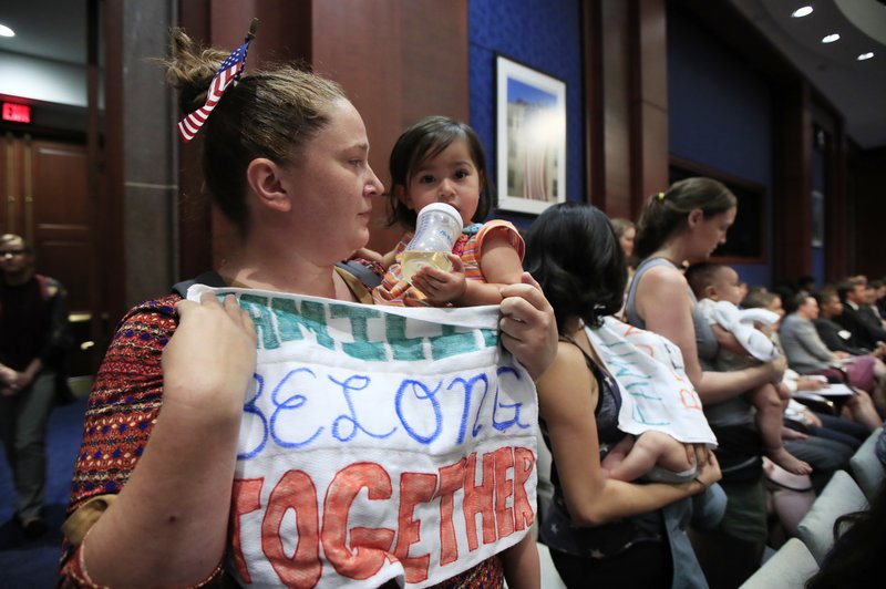 The Associated Press SUPPORT AND SYMPATHY: Lucy Martin and her daughter Branwen Espinal together with other mothers and their babies, attend a House Committee on the Judiciary and House Committee on Oversight and Government Reform hearing, to express their support and sympathy to immigrants and their families and objection to the forced separation of migrant children from their parents, on Capitol Hill in Washington, Tuesday.