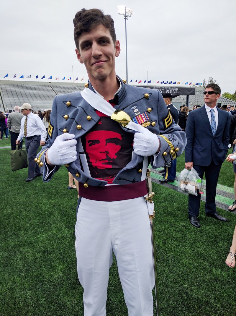 Spenser Rapone shows off his Che Guevara T-shirt underneath his uniform after he graduated from the United States Military Academy in May 2016.