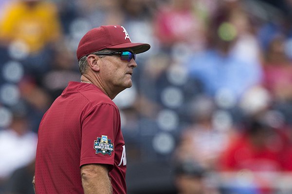 Arkansas coach Dave Van Horn walks toward the dugout during a College World Series game against Texas Tech on Wednesday, June 20, 2018, in Omaha, Neb.