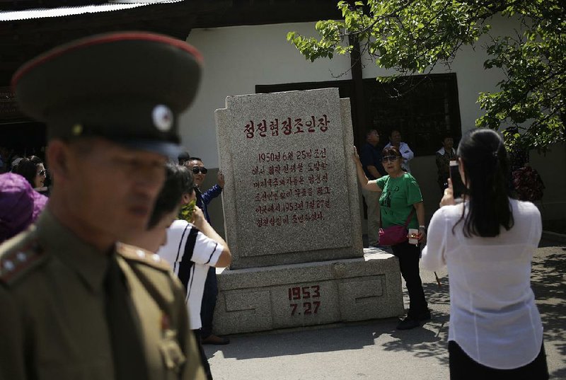 Chinese tourists take photos Wednesday outside the Museum of the Armistice Agreement in Panmunjom, North Korea. 