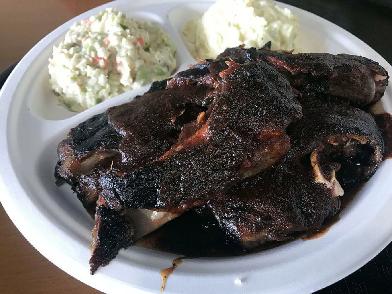 A Rib Plate is plated with slaw and potato salad at Casey’s Bar-B-Q.  
