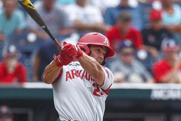 Arkansas outfielder Dominic Fletcher hits a home run during the fourth inning of a College World Series game against Texas Tech on Wednesday, June 20, 2018, in Omaha, Neb.