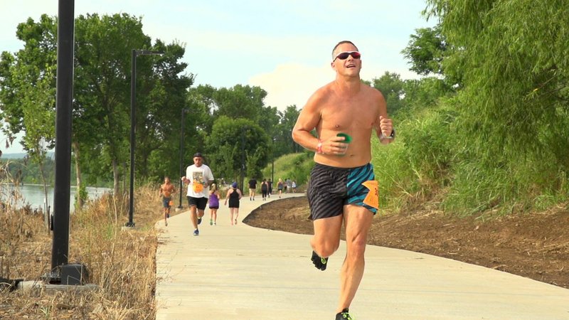 COURTESY PHOTO A runner enjoys the Fort Smith trail system. Ales for Trails Craft Beer Festival, scheduled for July 7 at Harry E. Kelley Park, will help fund more trails.