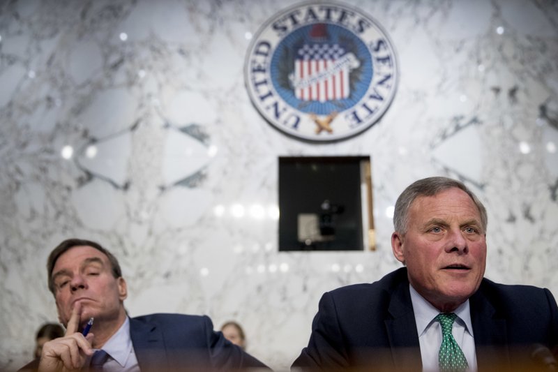 Senate Intelligence Chairman Richard Burr, R-N.C., right, accompanied by Committee Vice Chairman Mark Warner, D-Va., left, speaks during a Senate Intelligence Committee hearing on 'Policy Response to Russian Interference in the 2016 U.S. Elections' on Capitol Hill, Wednesday, June 20, 2018, in Washington. (AP Photo/Andrew Harnik)