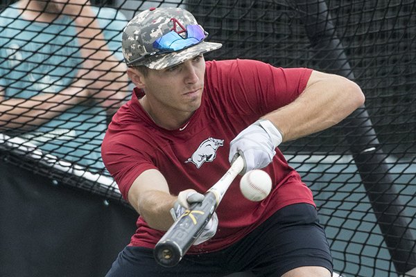 Arkansas second baseman Carson Shaddy practices bunting during on Thursday, June 21, 2018, at Creighton University in Omaha, Neb.