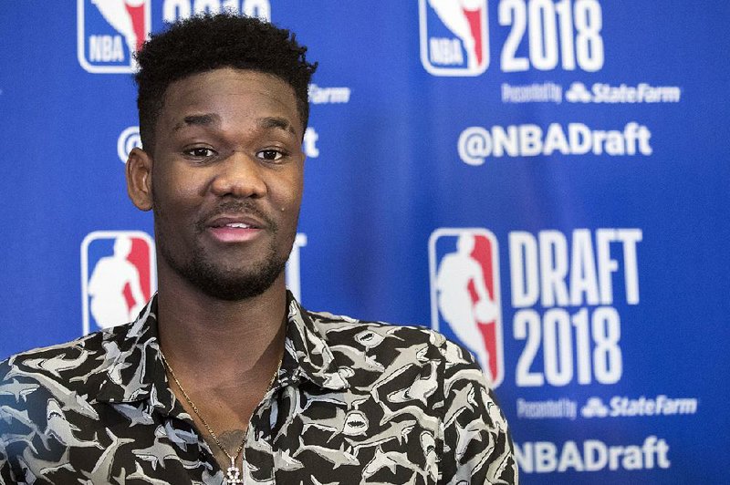 Arizona's DeAndre Ayton speaks to reporters during a media availability with the top basketball prospects in the NBA Draft, Wednesday, June 20, 2018, in New York. 