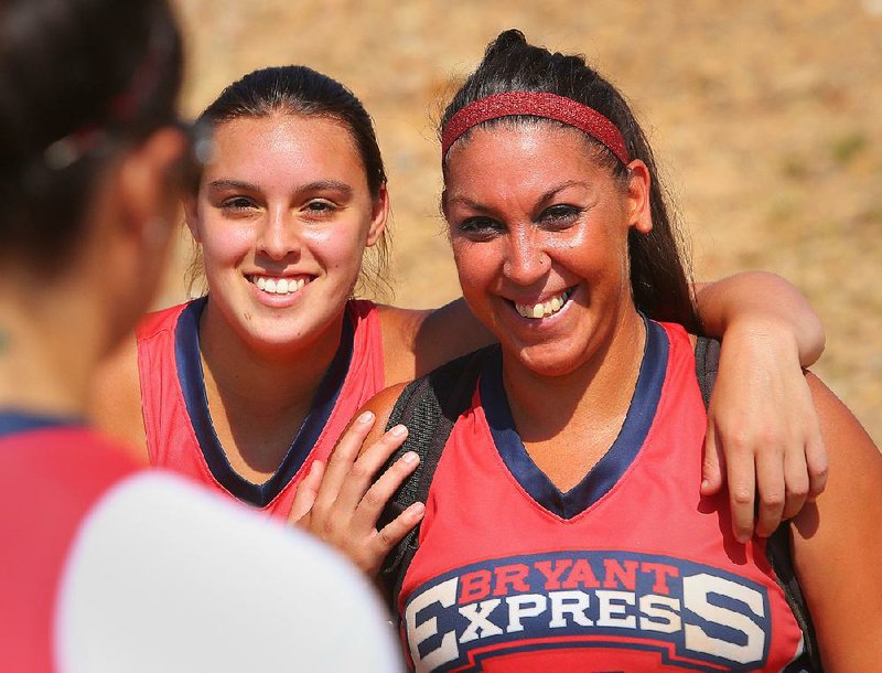 India Lewis, right, is shown in this 2013 file photo with her sister Marci Lewis.