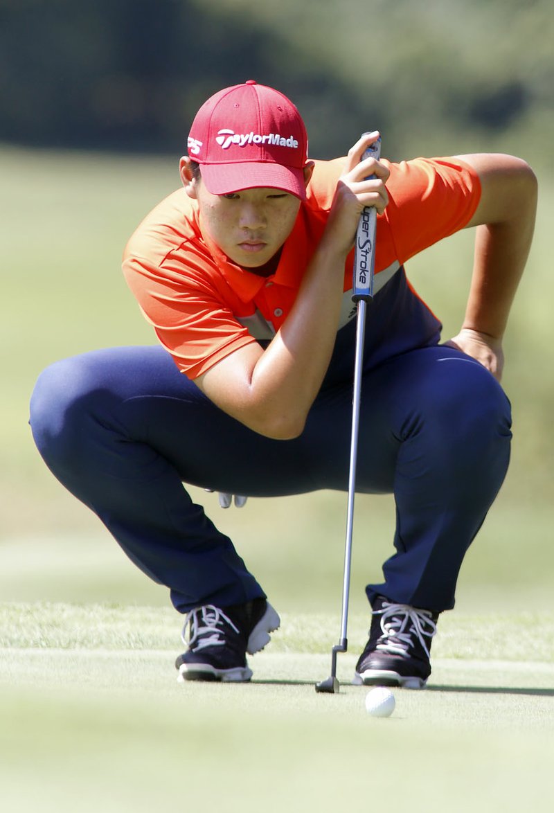 NWA Democrat-Gazette/DAVID GOTTSCHALK Kuangyu Chen, of Shenzhen, China, lines up a putt Thursday, June 21, 2018, during the final round of play of the KPMG Stacy Lewis Junior All-Star Invitational at the Blessings Golf Club in Johnson.