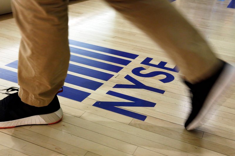 FILE- In this April 5, 2018, file photo, an NYSE logo adorns the entrance to the trading floor the New York Stock Exchange. The U.S. stock market opens at 9:30 a.m. EDT on Thursday, June 21. (AP Photo/Richard Drew, File)