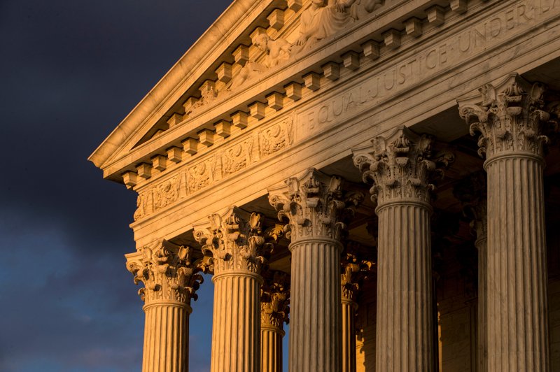 FILE - In this Oct. 10, 2017, file photo, the Supreme Court in Washington is seen at sunset. States will be able to force shoppers to pay sales tax when they make online purchases under a Supreme Court decision June 21, 2018, that will leave shoppers with lighter wallets but is a big win for states. (AP Photo/J. Scott Applewhite, File)