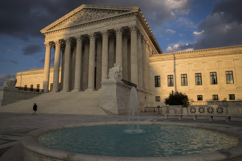 In this Oct. 10, 2017 file photo, the Supreme Court in Washington is seen at sunset. In a 5-4 decision Friday, The Supreme Court says police generally need a search warrant if they want to track criminal suspects' movements by collecting information about where they've used their cellphones. (AP Photo/J. Scott Applewhite)